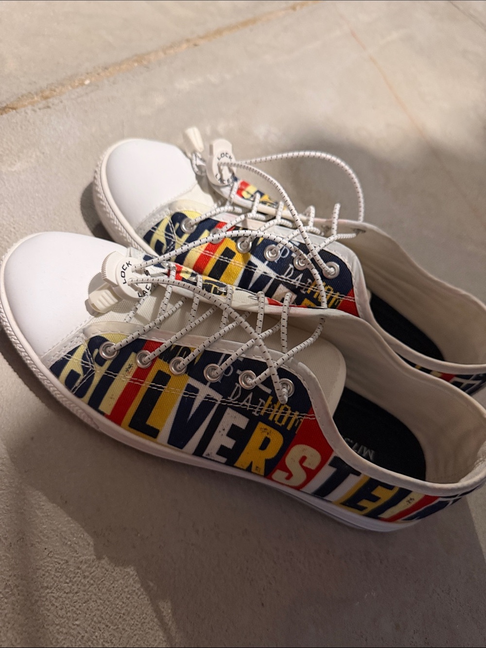 White Low-Top Graphic Sneakers with Navy, Red and Yellow Stripes